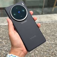 Vivo X100 Pro smartphone in hand, showcasing its sleek design and camera system.